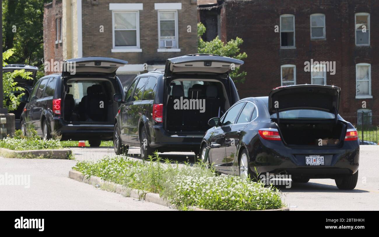 St. Louis, United States. 23rd May, 2020. Cars, with their trunks open, wait in line at the St. Louis Urban League's food give-a-way in St. Louis on Saturday, May 23, 2020. The 3300 cars that will get food will receive enough food to feed a family of four for several days. This event is the eighth food give-a-way put on by the Urban League. Many are in need of the food due to the coronavirus. Photo by Bill Greenblatt/UPI Credit: UPI/Alamy Live News Stock Photo