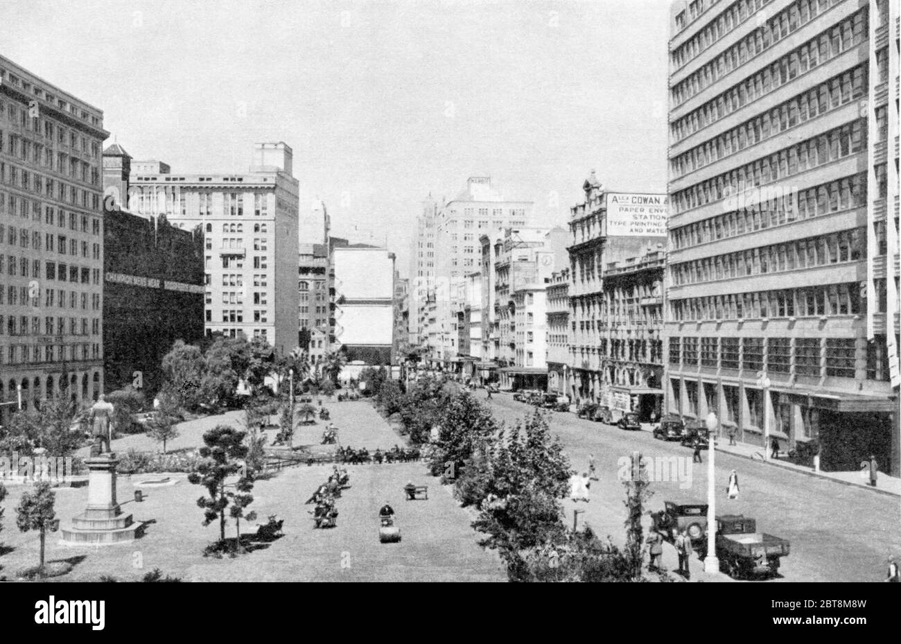 Looking south along York Street, Sydney, Australia in 1938 with Wynyard Square and the statue of John Dunmore Lang, a founder of the Presbyterian Church in Australia, on left and the new multi storey New South Wales Railways building on the right. Much has changed in the 82 years since this image was taken but the railways building is still in use. This image was published in a book by Municipal Council of Sydney to commemorate 'the 150th anniversary of the founding of a nation' Stock Photo