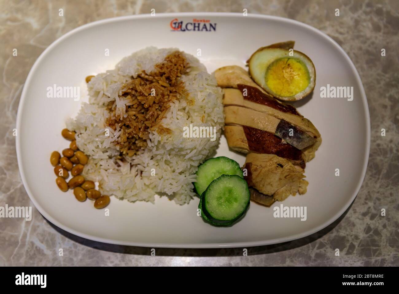Singapore - September 08, 2019: Traditional soya sauce chicken rice at the World's cheapest Michelin star Liao Fan Hawker Chan Chinatown restaurant Stock Photo