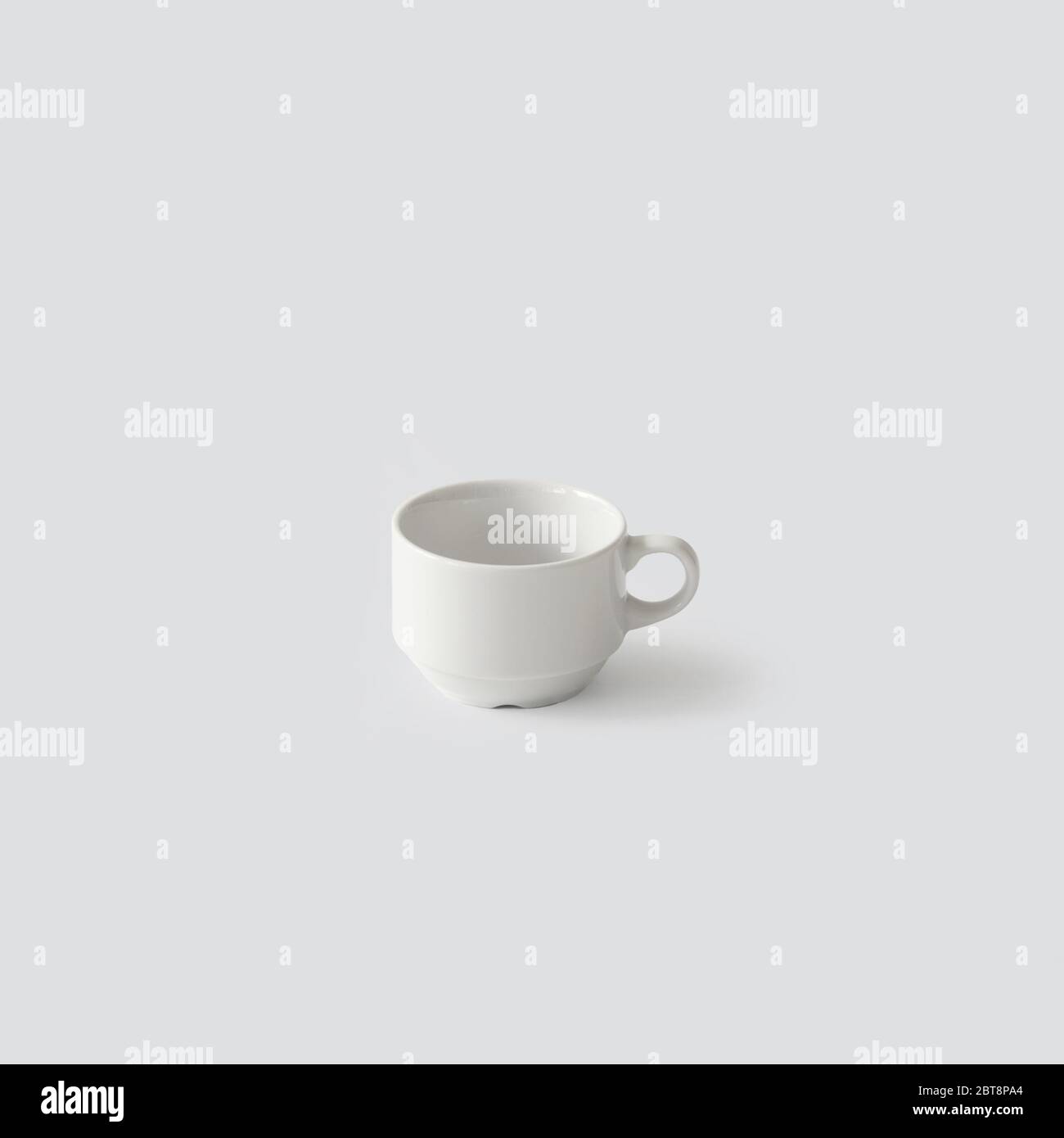 empty white coffee cup isolated on light grey background Stock Photo