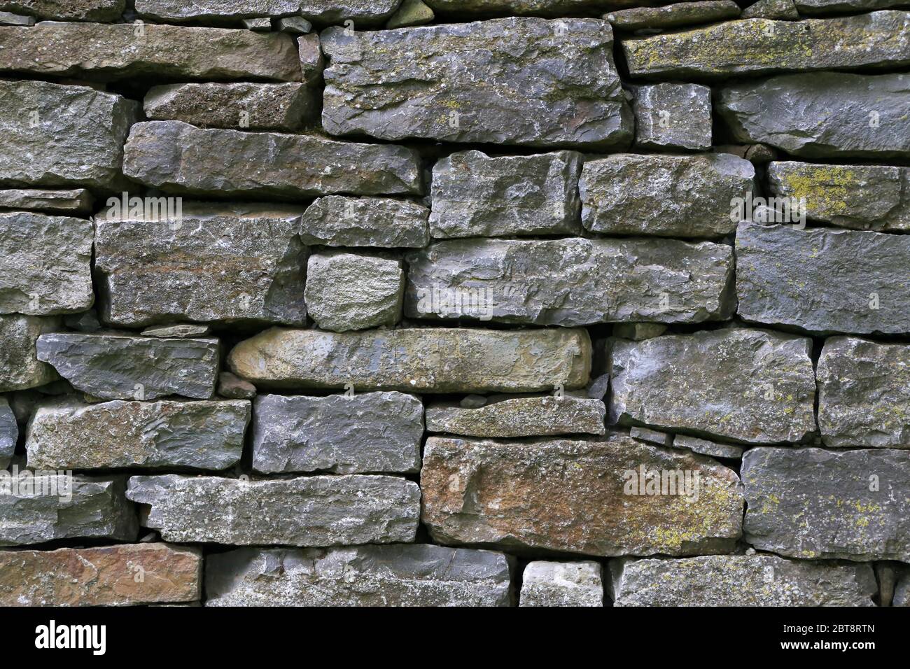 Wall of natural stones of gray color Stock Photo - Alamy