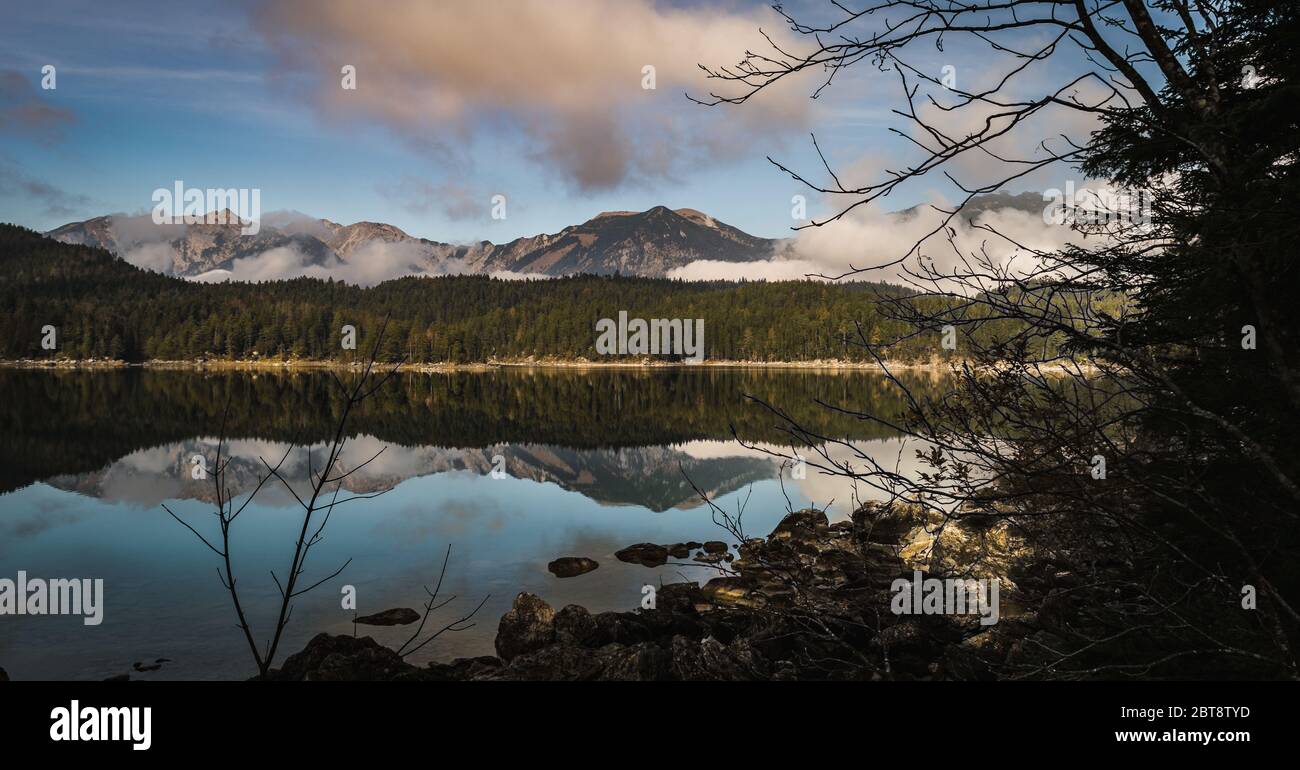 Spectacular view of Lake Eibsee with the Zugspitze on a reflection on a ...