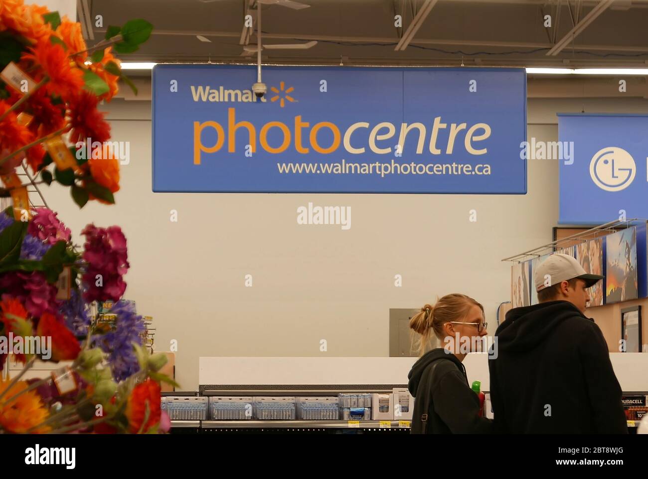 Motion of photo centre sign on printing photo section inside Walmart Stock Photo