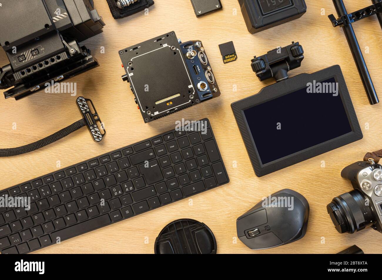 Overhead view of computer parts and filming accessories on table Stock Photo