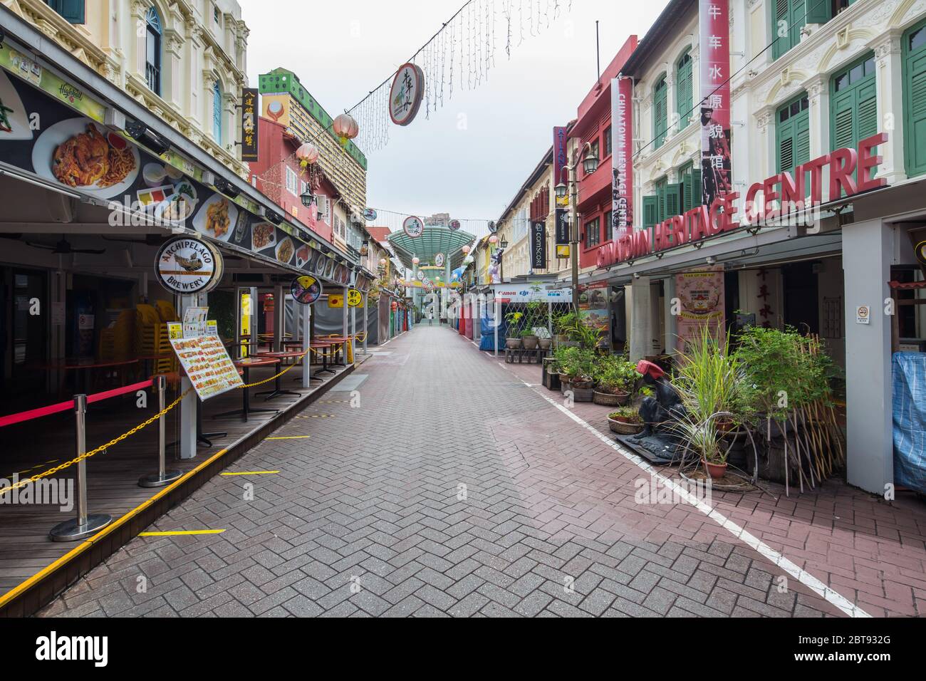 Restaurants and various business down the streets is closed, once filled with tourists become an empty street. Singapore. Stock Photo