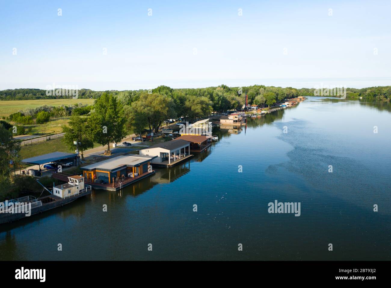 Floating houses on Tisza river in Tiszafured, Hungary. Idyllic life close to nature. Stock Photo
