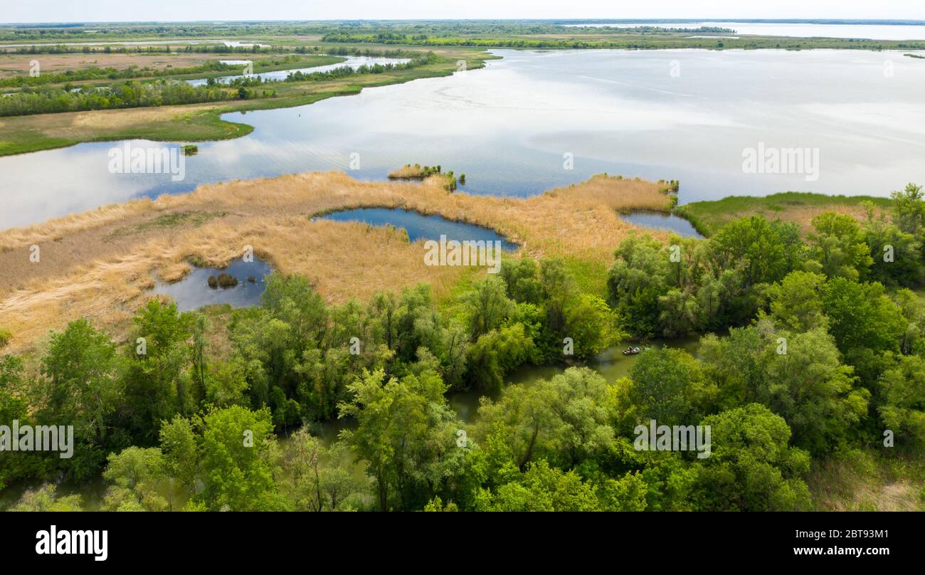Aerial view of Tisza Lake. Natural landscape with reed, water and tree. Stock Photo
