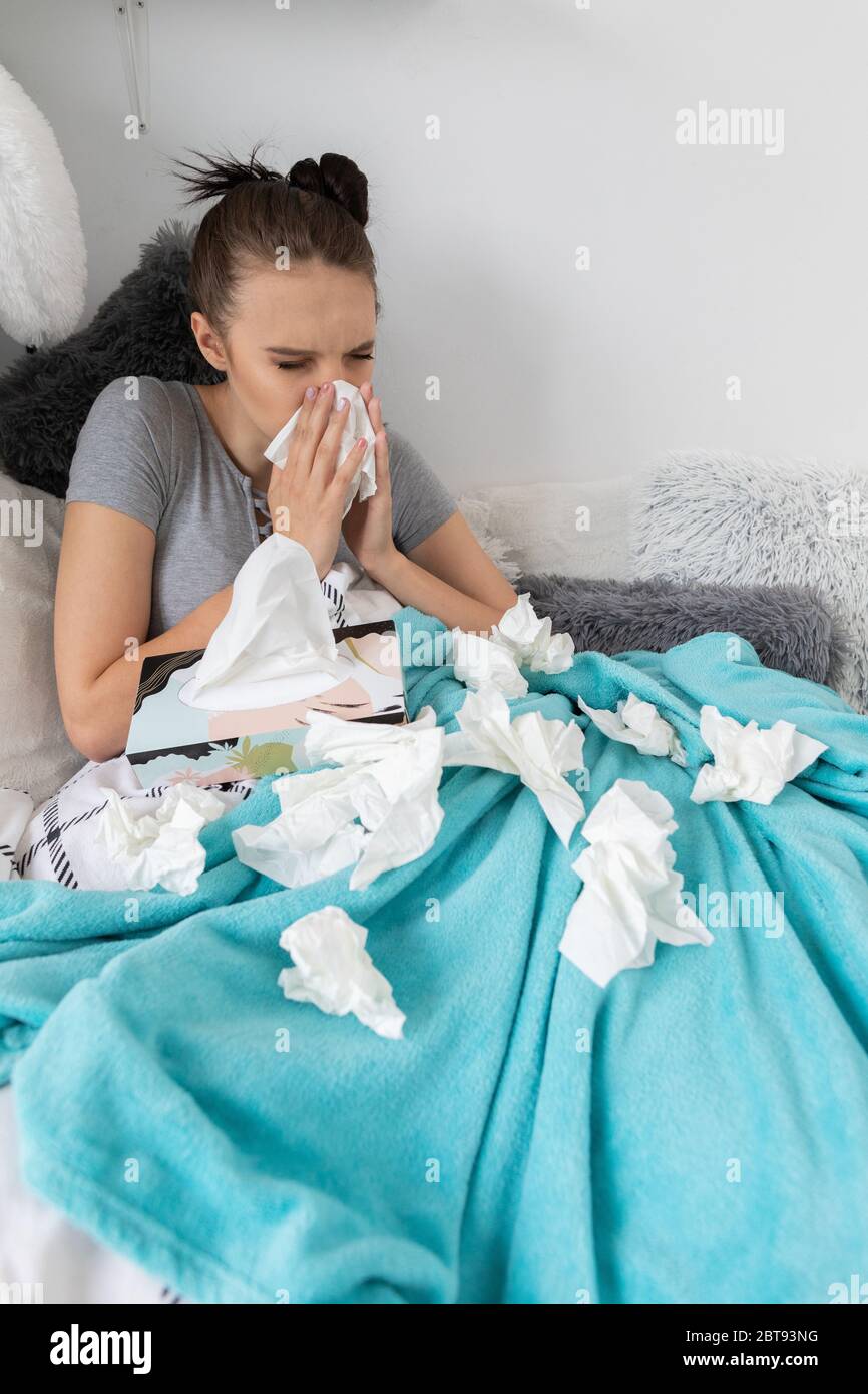 A severe cold causing a headache and the need to constantly wipe the