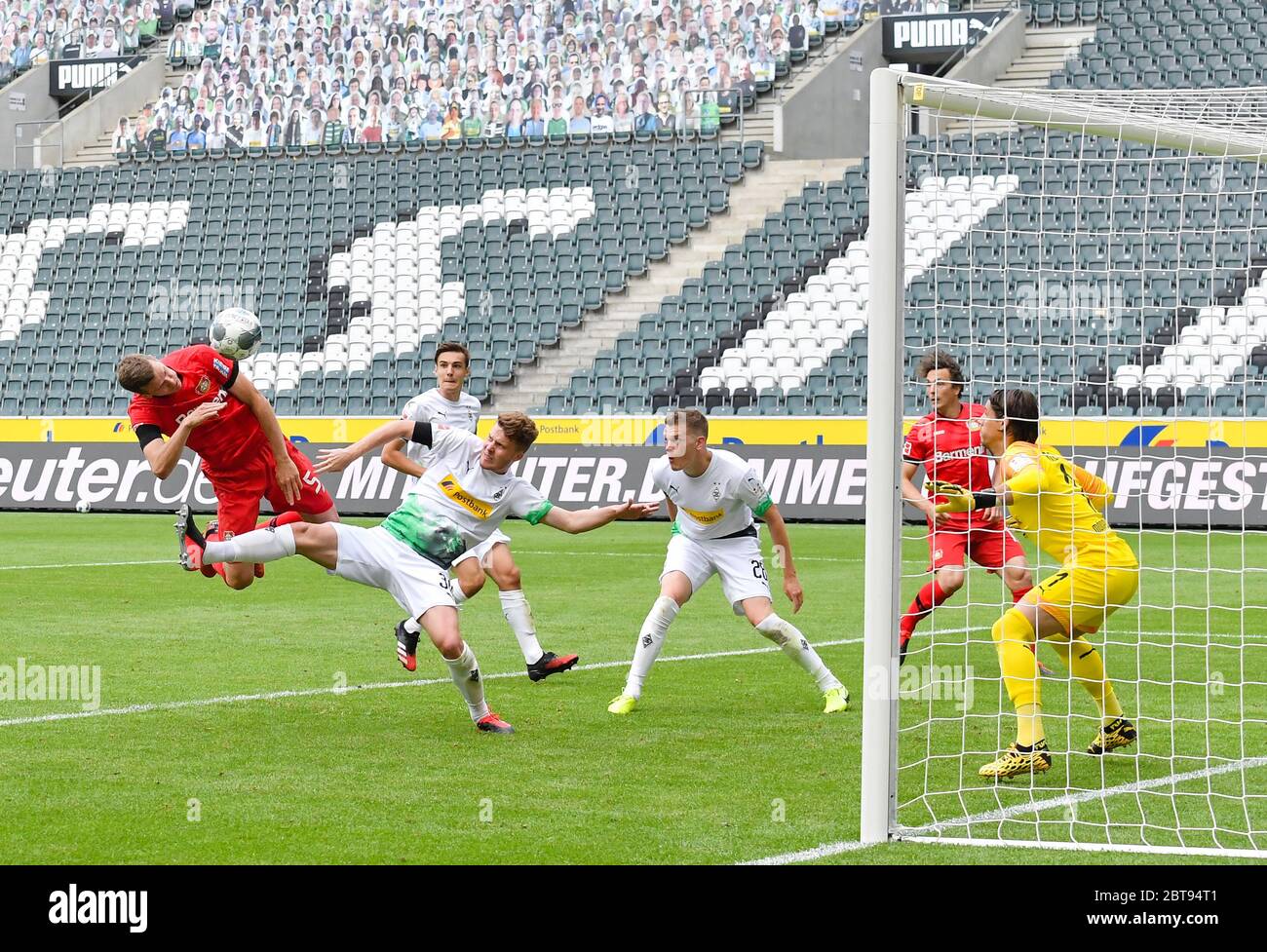 Borussia Park Moenchengladbach Germany, Football: German Bundesliga matchday 27, Borussia Moenchengladbach (BMG, white) vs Bayer 04 Leverkusen (B04, red) 1:3 — header goal for the 1:3 by Sven Bender (Leverkusen) against Nico Elvedi (BMG), Matthias Ginter (BMG) and   Yann Sommer (BMG)  . Because of the Corona virus pandemic all german league matches are played in empty stadiums without spectators.  Foto: Maik Hölter/team2sportphoto/Pool/via Kolvenbach  Only for editorial use!   DFL regulations prohibit any use of photographs as image sequences and/or quasi-video. Stock Photo