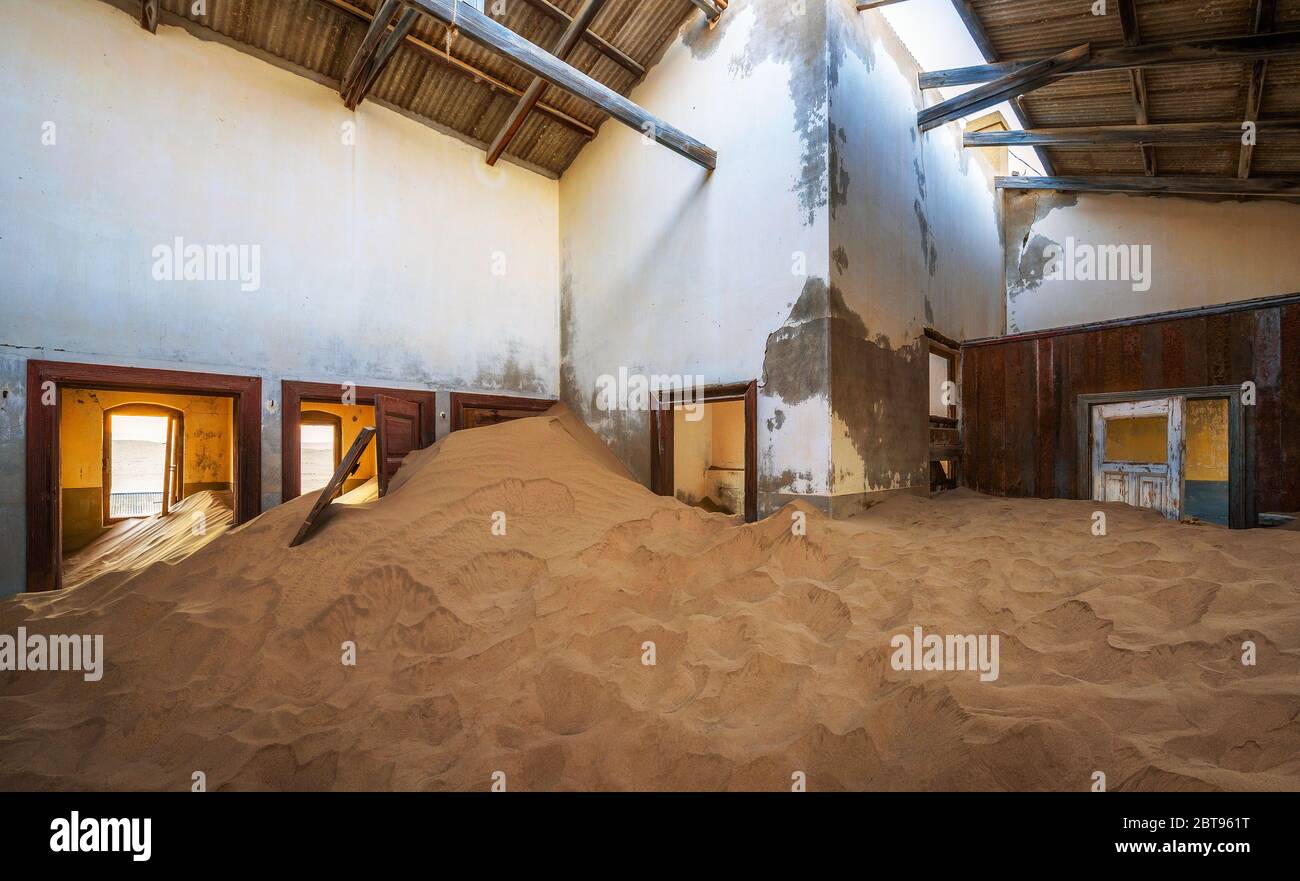 Ruins of a house filled with sand in the mining town Kolmanskop, Namibia Stock Photo