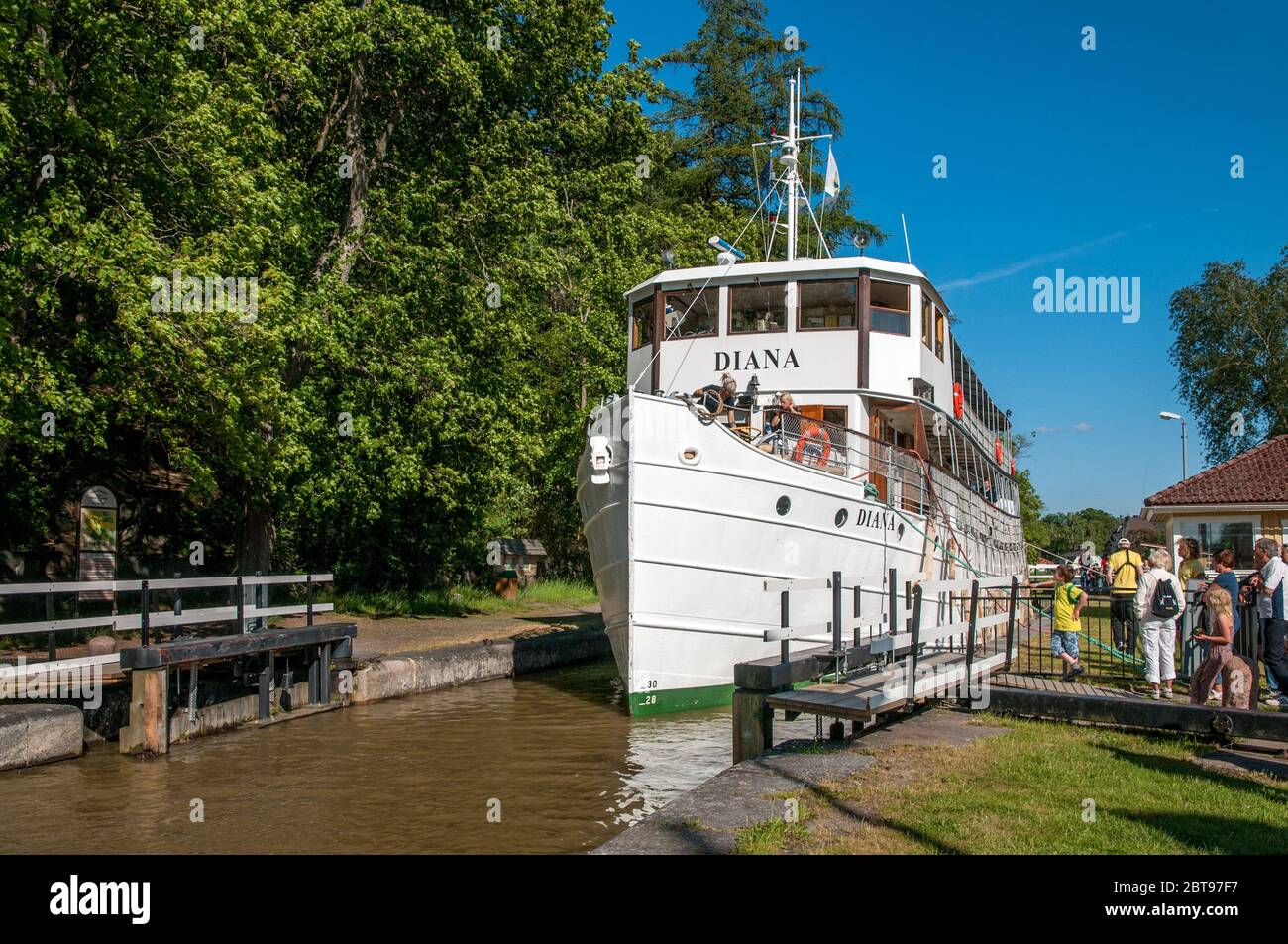 M/S Diana crusing Göta Canal on a sunny summer day in historic smalltown Söderköping, Sweden. The ship was built in 1931. Stock Photo