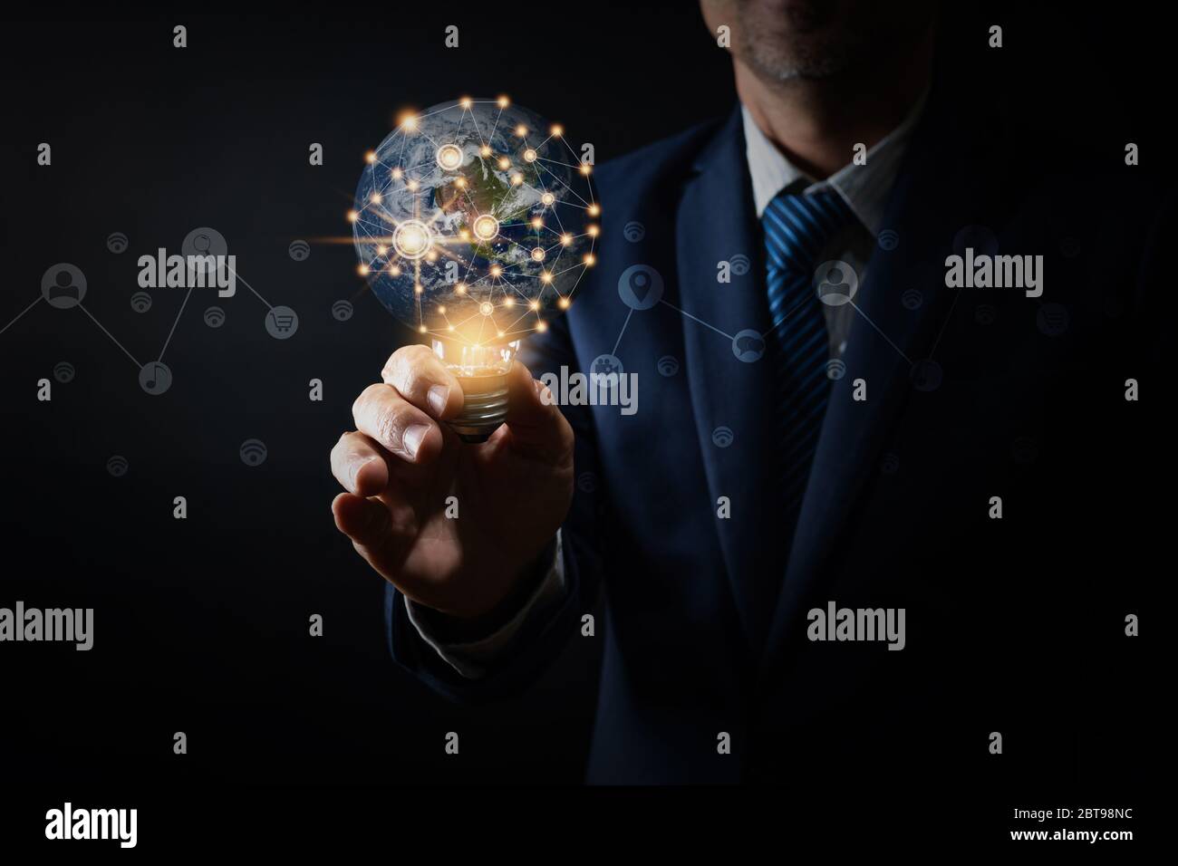 Innovation and idea of professional leader holding lighting bulb ...