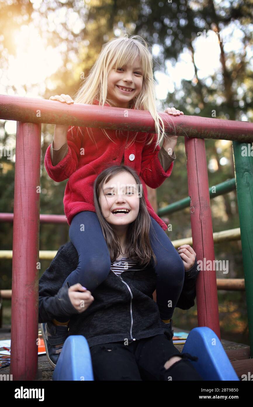 young friends have a nice time together while playing outside Stock Photo