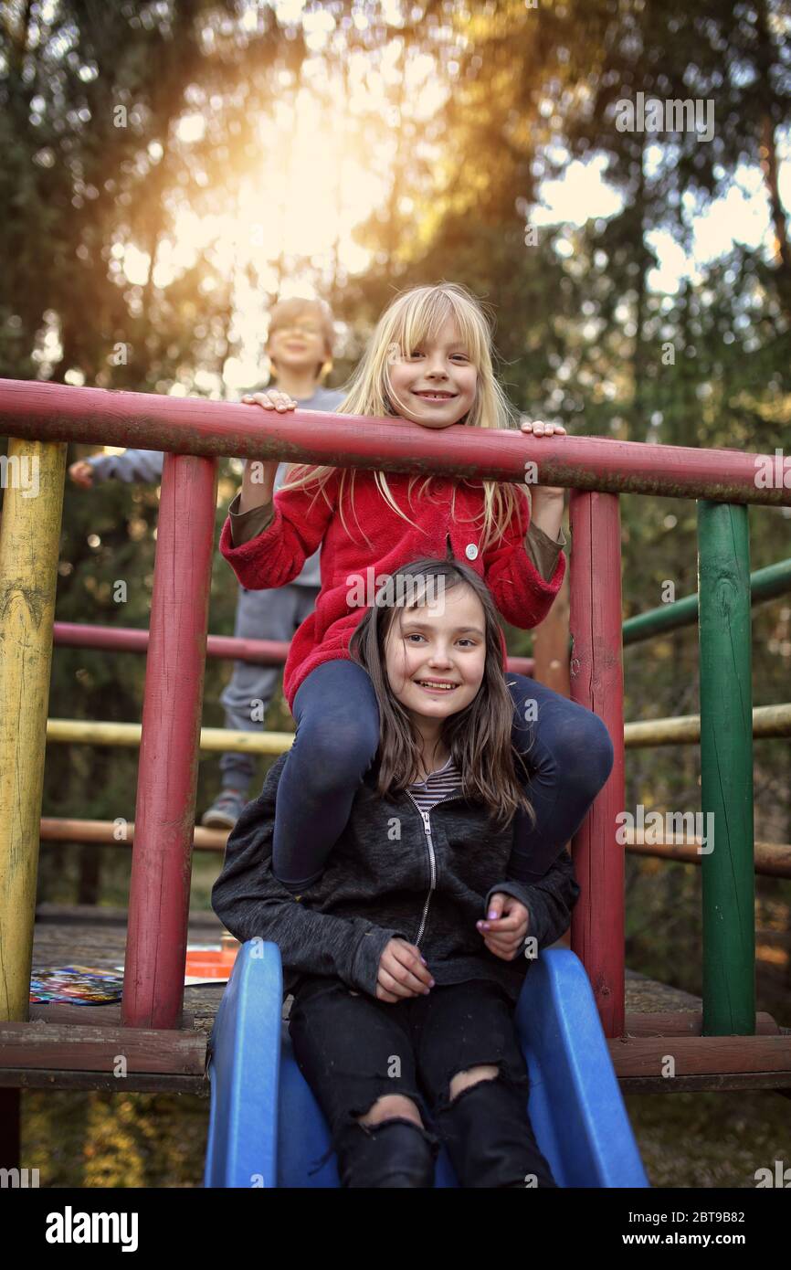 young friends have a nice time together while playing outside Stock Photo