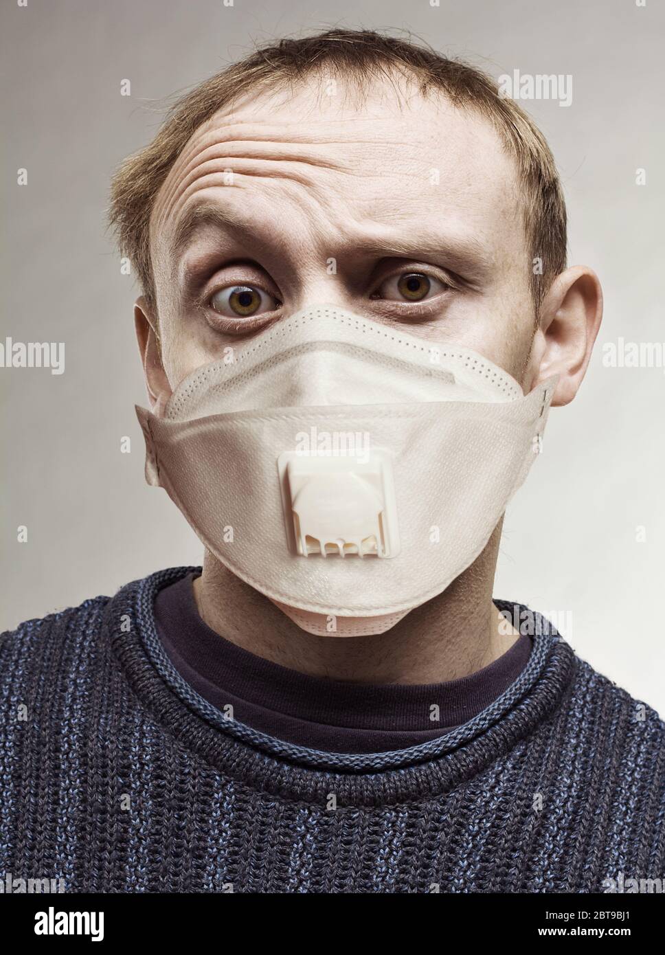 Surprised man in protective mask portrait Stock Photo