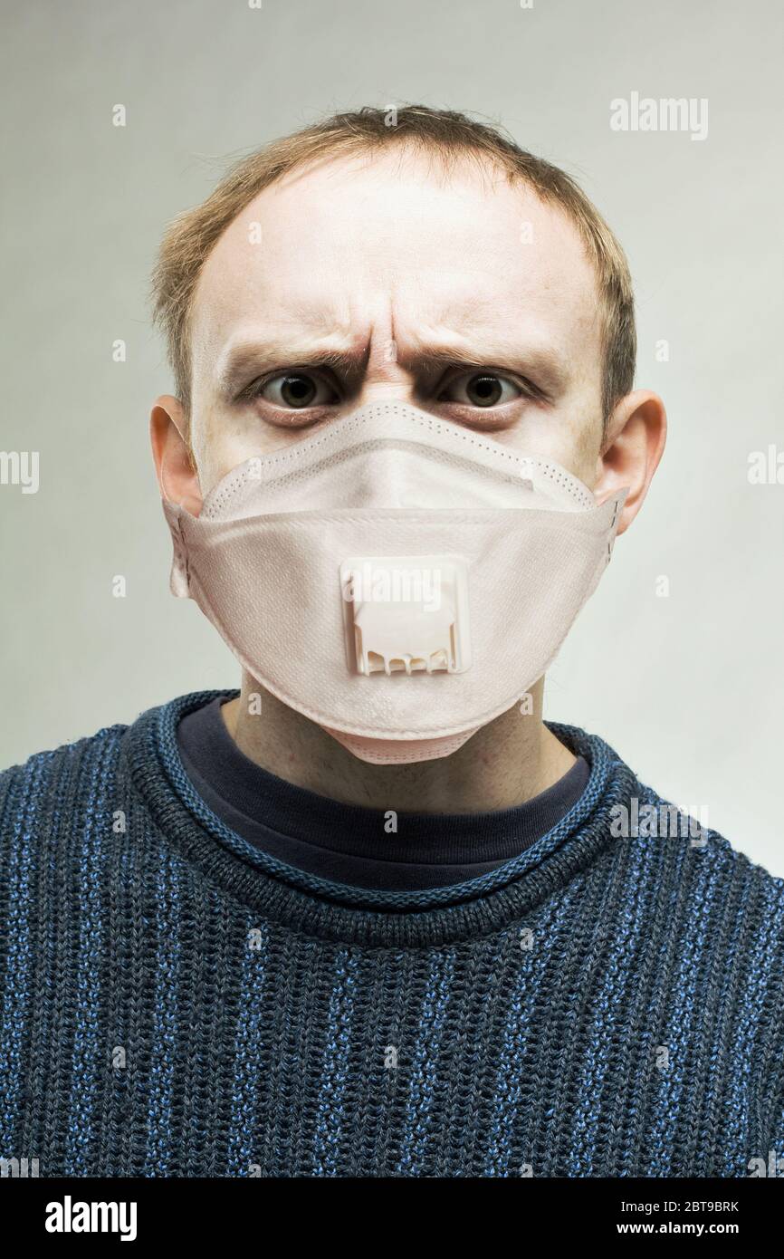 Shocked man in protective mask portrait Stock Photo