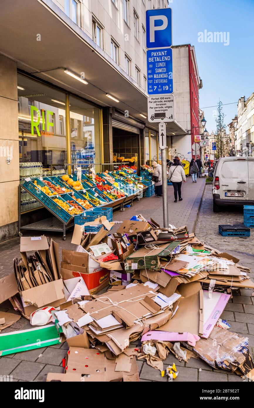 Flattened cardboard boxes outside supermarket awaiting council rubbish collection - Saint-Gilles, Brussels, Belgium. Stock Photo