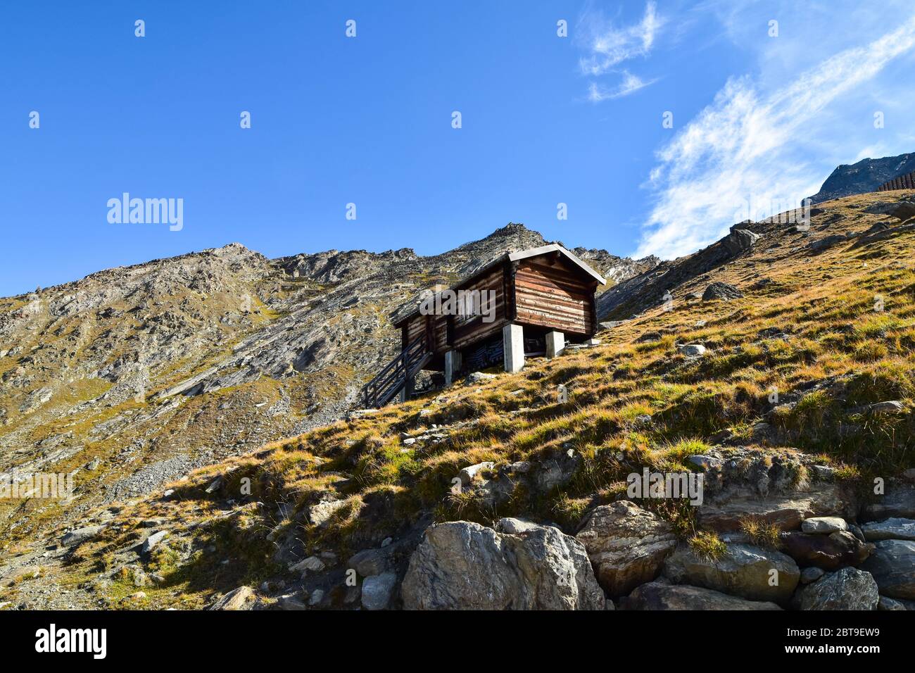 Farm building in alp mountain landscape. Stock Photo