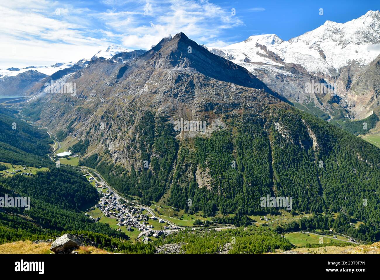 Mountain panorama with ski resort Saas Almagell in valley. Stock Photo