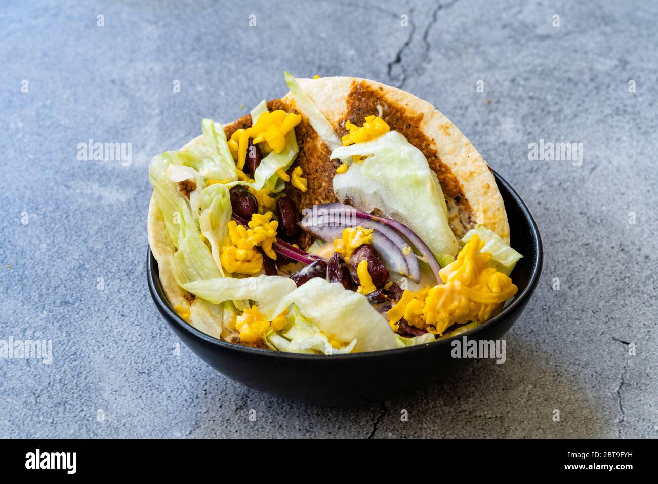 Turkish Mexican Style Taco Cig Kofte with Kidney Beans, Red Onions, Grated Cheddar Cheese and Pomegranate Syrup Sauce. Traditional Fast Food. Stock Photo