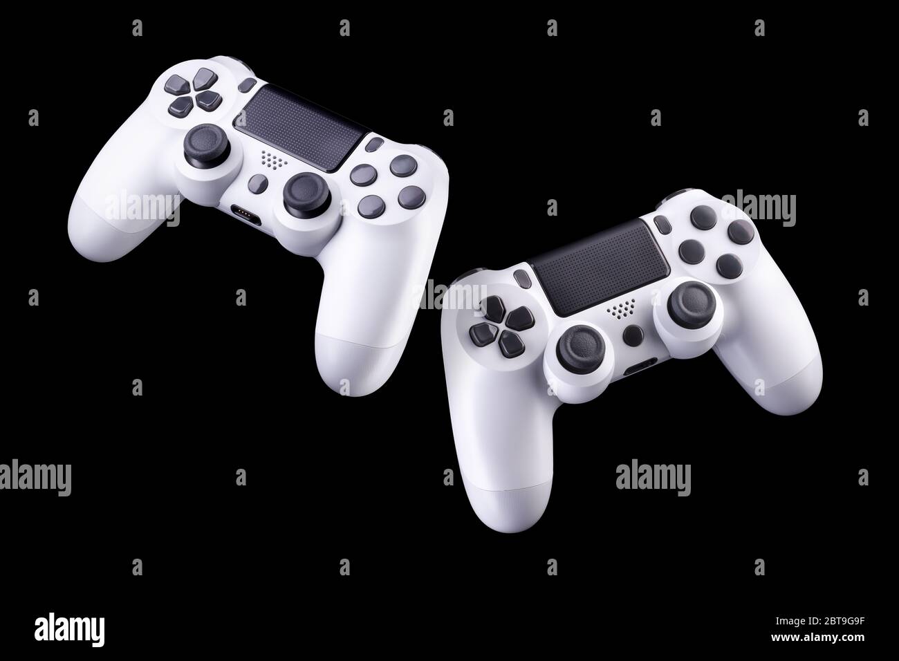 Set of white video game joysticks gamepad isolated on a black ...