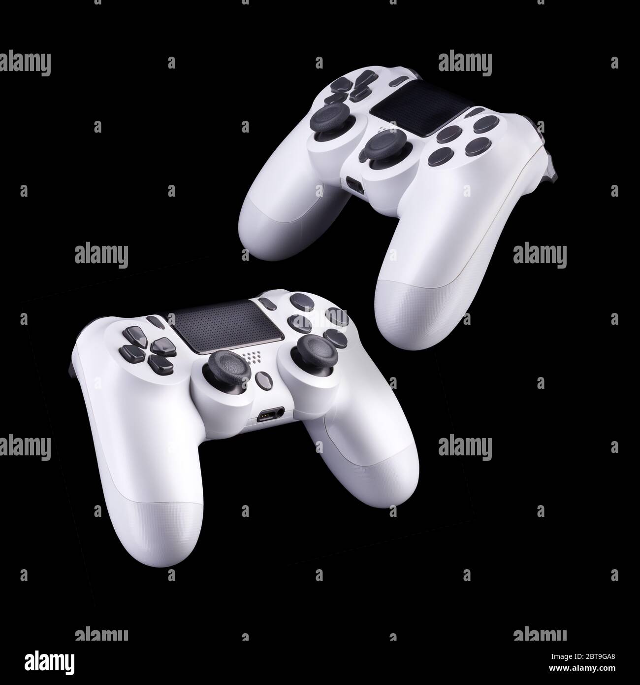 Set of white video game joysticks gamepad isolated on a black ...