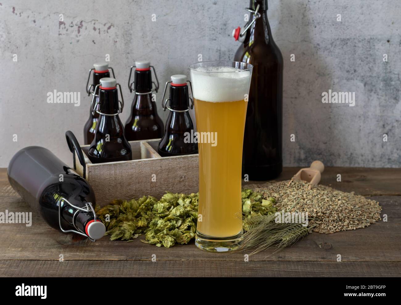 Glass of homemade unfiltered beer with growlers Stock Photo Alamy