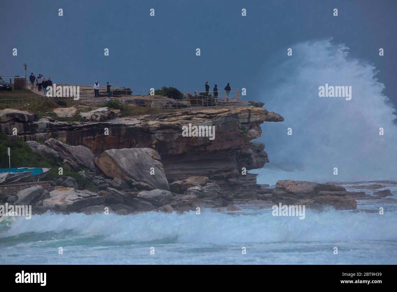 Sydney, Australia. Sunday 24th May 2020. Bondi Beach in Sydney's Eastern suburbs experiences very rough surf conditions today with  massive waves. People seen watching the rough surf conditions at Ben Buckler Point, Bondi. Credit Paul Lovelace/Alamy Live News Stock Photo