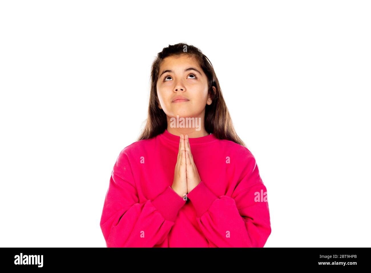 Adorable preteen girl with pink jersey isolated on a white background Stock Photo