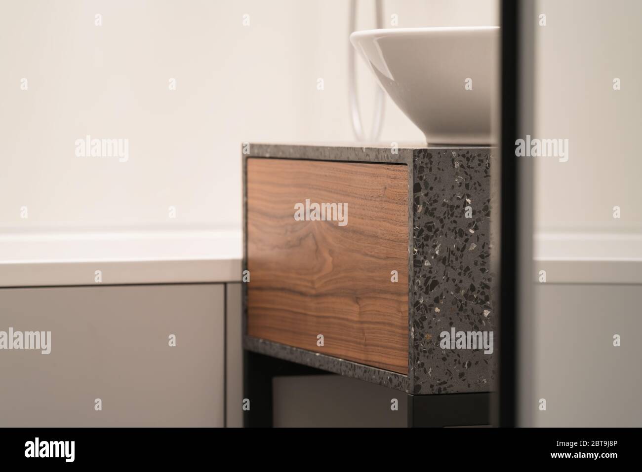 Iterior Shot Of Bathroom Terrazzo Concrete Cabinet With Walnut Drawer And White Round Sink Shallow Focus Stock Photo Alamy
