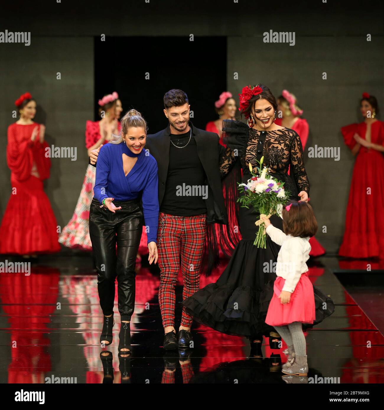 SEVILLA, SPAIN - JAN 31: Designer Adelina Infante accompanied by singer Rasel and actress Amor Romeira at the end of her Dualismo collection runway as part of the SIMOF 2020 (Photo credit: Mickael Chavet) Stock Photo