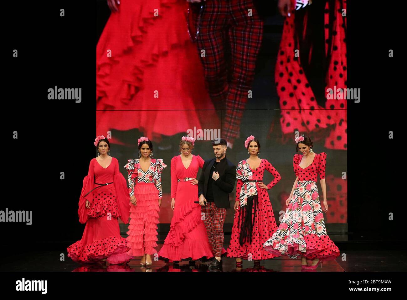 SEVILLA, SPAIN - JAN 31: Singer Rasel and models wearing dresses from the Dualismo collection by designer Adelina Infante as part of the SIMOF 2020 (Photo credit: Mickael Chavet) Stock Photo