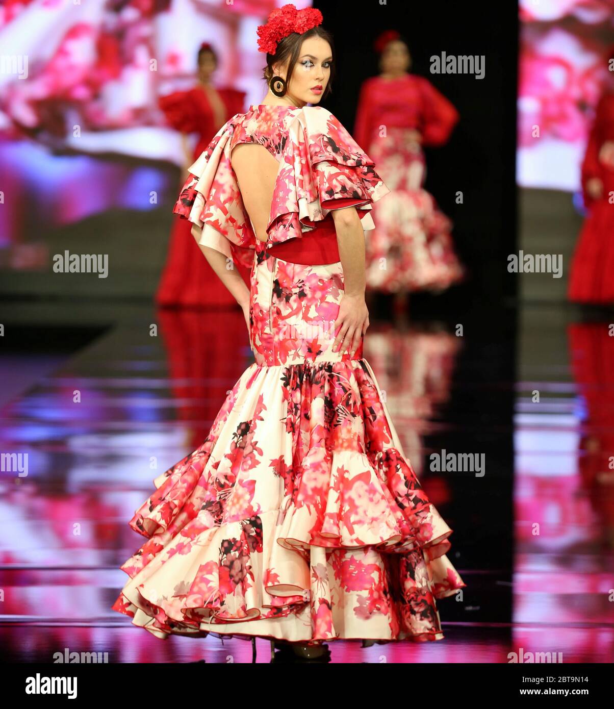 SEVILLA, SPAIN - JAN 31: Model wearing a dress from the Dualismo collection by designer Adelina Infante as part of the SIMOF 2020 (Photo credit: Mickael Chavet) Stock Photo