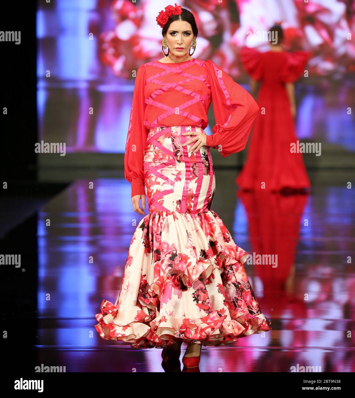 SEVILLA, SPAIN - JAN 31: Model wearing a dress from the Dualismo collection by designer Adelina Infante as part of the SIMOF 2020 (Photo credit: Mickael Chavet) Stock Photo