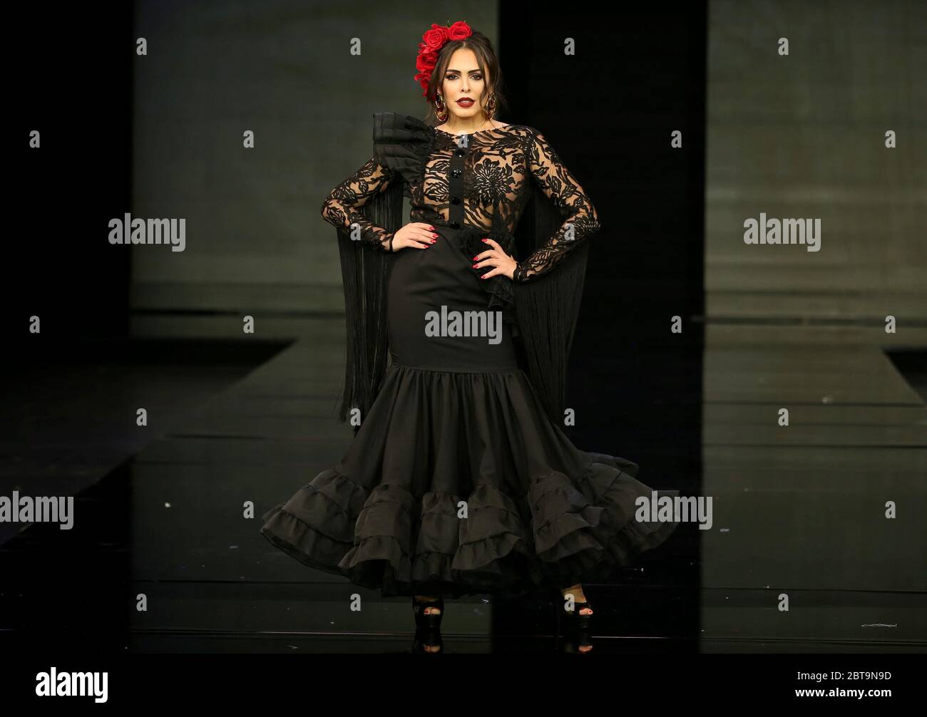SEVILLA, SPAIN - JAN 31: Singer Amor Romeira wearing a dress from the Dualismo collection by designer Adelina Infante as part of the SIMOF 2020 (Photo credit: Mickael Chavet) Stock Photo