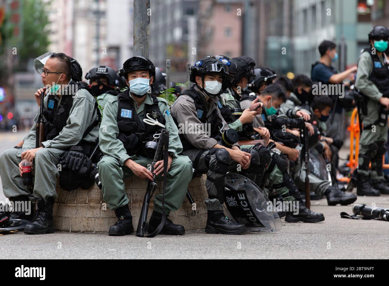 Hong Kong, 24th May 2020. HK Police resting roadside. Credit: David Ogg / Alamy Live News Stock Photo