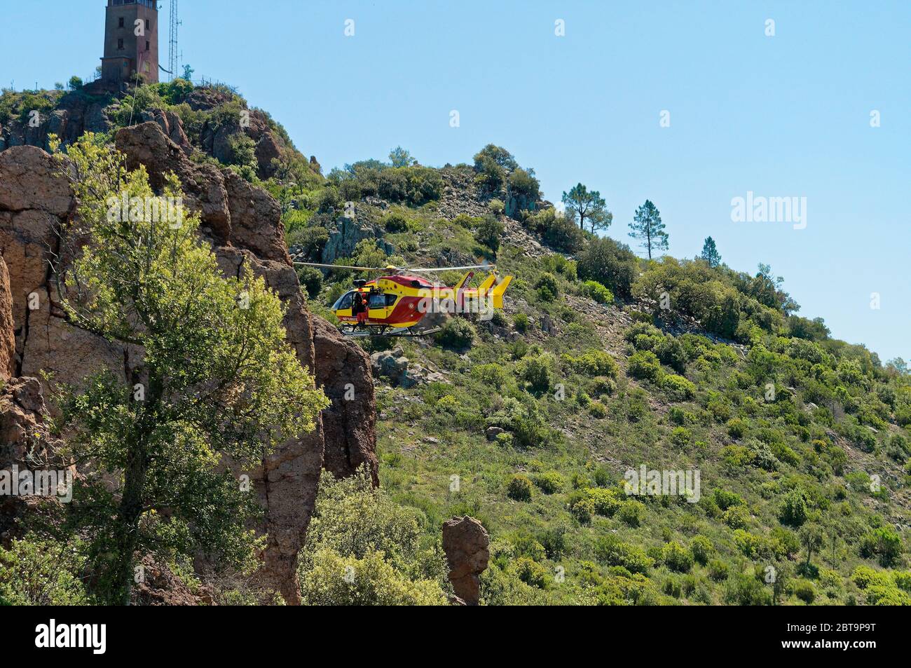 French Sécurité Civile EC145 Helicopter training in Esterel mountains (Var) Stock Photo