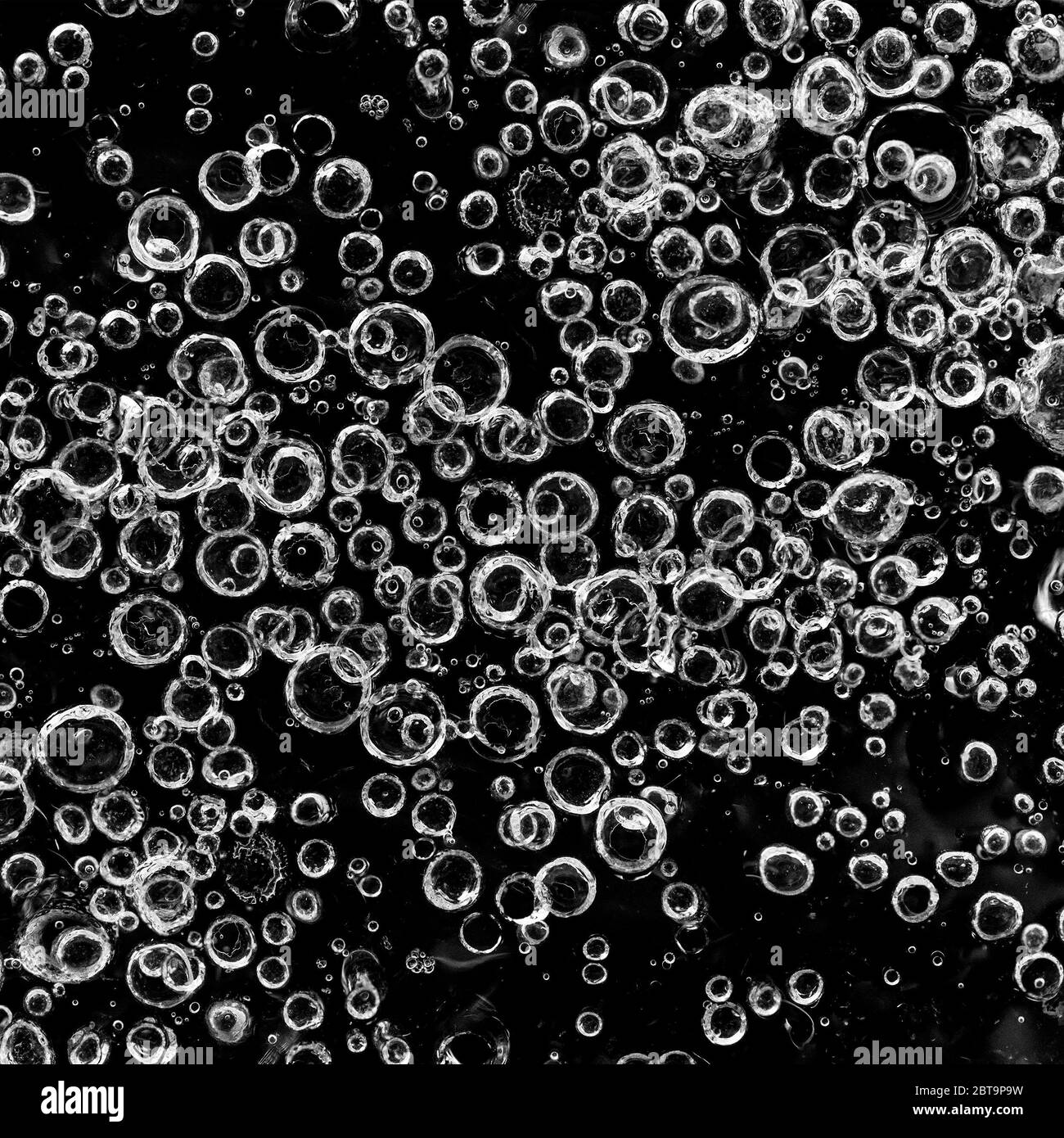 Beautiful Close-up on air bubbles stuck in frozen water Stock Photo