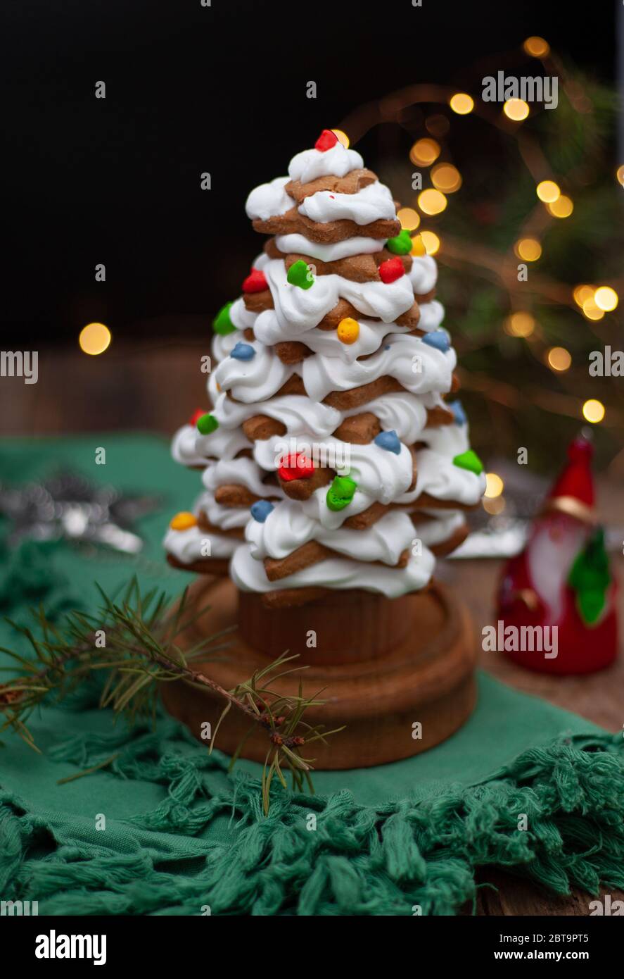 Baked gingerbread christmas tree on wooden background. Close-up Stock ...
