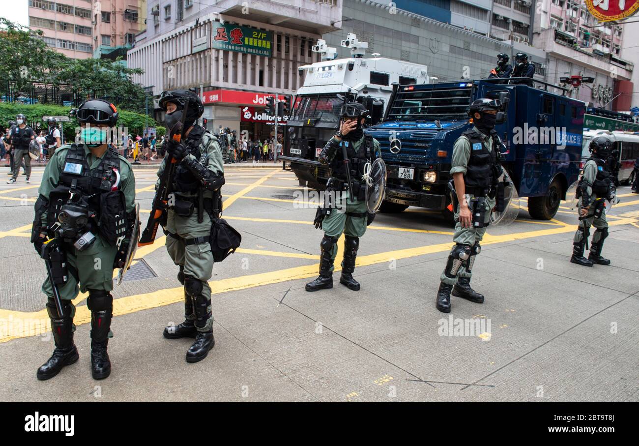 Hong Kong, China. 24th May, 2020. HONG KONG, HONG KONG SAR, CHINA: MAY 24th 2020. Twenty-three years after Hong Kong was handed by Britain back to Chinese rule, Beijing is pushing to implement tough new national security laws that will suppress the pro-democracy protests seen in the city. It is believed to be the end of the handover deal where China agreed to the one country, two systems idea. People take to the streets for an illegal protest in Causeway Bay shopping district Alamy Live news/Jayne Russell Credit: Jayne Russell/Alamy Live News Stock Photo