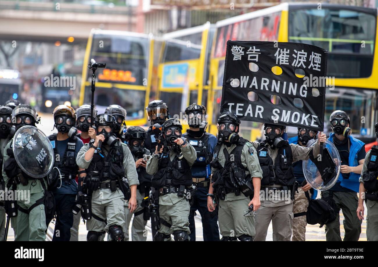 Hong Kong, China. 24th May, 2020. HONG KONG, HONG KONG SAR, CHINA: MAY 24th 2020. Twenty-three years after Hong Kong was handed by Britain back to Chinese rule, Beijing is pushing to implement tough new national security laws that will suppress the pro-democracy protests seen in the city. It is believed to be the end of the handover deal where China agreed to the one country, two systems idea. People take to the streets for an illegal protest in Causeway Bay shopping district.Police warn of tear gas use Alamy Live news/Jayne Russell Credit: Jayne Russell/Alamy Live News Stock Photo