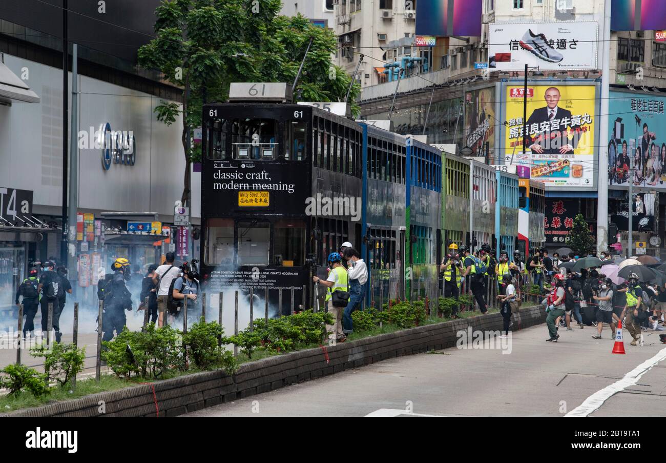 Hong Kong, China. 24th May, 2020. HONG KONG, HONG KONG SAR, CHINA: MAY 24th 2020. Twenty-three years after Hong Kong was handed by Britain back to Chinese rule, Beijing is pushing to implement tough new national security laws that will suppress the pro-democracy protests seen in the city. It is believed to be the end of the handover deal where China agreed to the one country, two systems idea. People take to the streets for an illegal protest in Causeway Bay shopping district Alamy Live news/Jayne Russell Credit: Jayne Russell/Alamy Live News Stock Photo