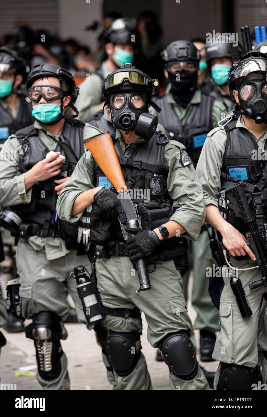 Hong Kong, China. 24th May, 2020. HONG KONG, HONG KONG SAR, CHINA: MAY 24th 2020. Twenty-three years after Hong Kong was handed by Britain back to Chinese rule, Beijing is pushing to implement tough new national security laws that will suppress the pro-democracy protests seen in the city. It is believed to be the end of the handover deal where China agreed to the one country, two systems idea. People take to the streets for an illegal protest in Causeway Bay shopping district Alamy Live news/Jayne Russell Credit: Jayne Russell/Alamy Live News Stock Photo