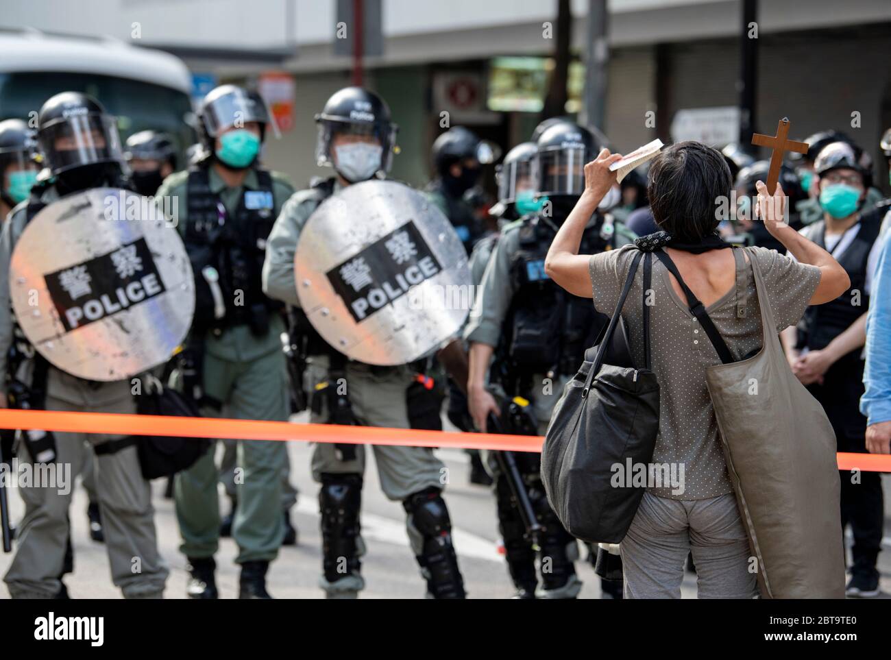 Hong Kong, China. 24th May, 2020. HONG KONG, HONG KONG SAR, CHINA: MAY 24th 2020. Twenty-three years after Hong Kong was handed by Britain back to Chinese rule, Beijing is pushing to implement tough new national security laws that will suppress the pro-democracy protests seen in the city. It is believed to be the end of the handover deal where China agreed to the one country, two systems idea. People take to the streets for an illegal protest in Causeway Bay shopping district Alamy Live news/Jayne Russell Credit: Jayne Russell/Alamy Live News Stock Photo