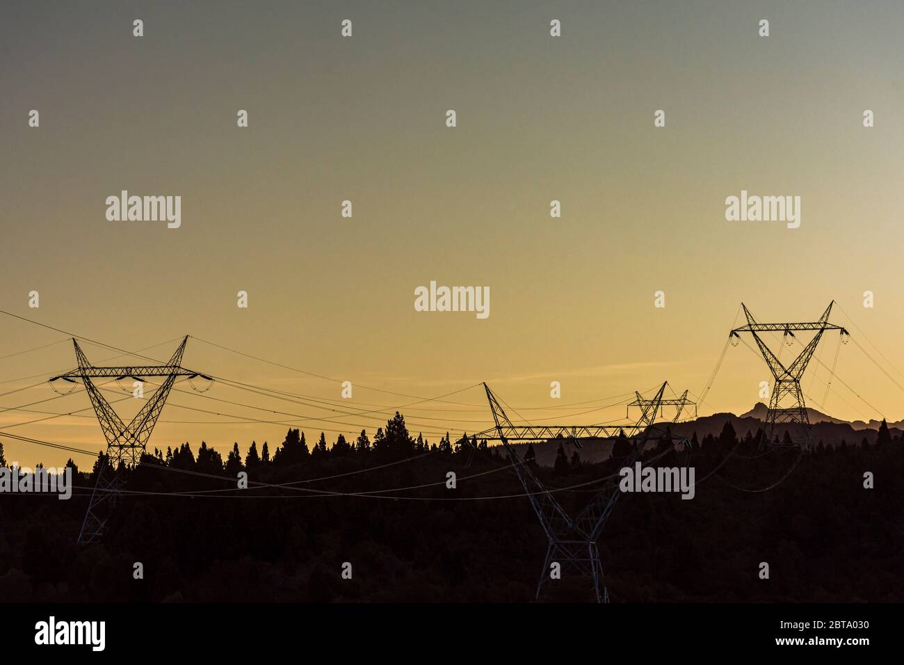 Scene view high voltage power lines silhouette at sunset Stock Photo ...