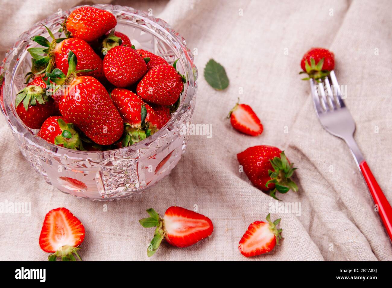 Strawberries in crystal bowl hi-res stock photography and images - Alamy