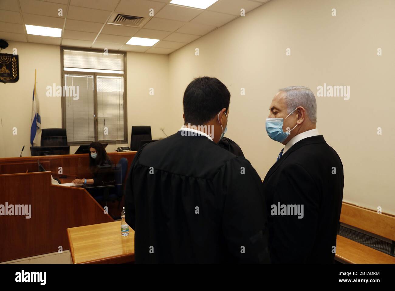 Jerusalem, Israel. 24th May, 2020. Israeli Prime Minister Benjamin Netanyahu, wearing a face mask, looks on while standing inside the court room as his corruption trial opens at the Jerusalem District Court on Sunday, May 24, 2020. Netanyahu attacked the Israeli justice system as he became the first sitting prime minister to go on trial. Pool Photo by Ronen Zvulun/UPI Credit: UPI/Alamy Live News Stock Photo