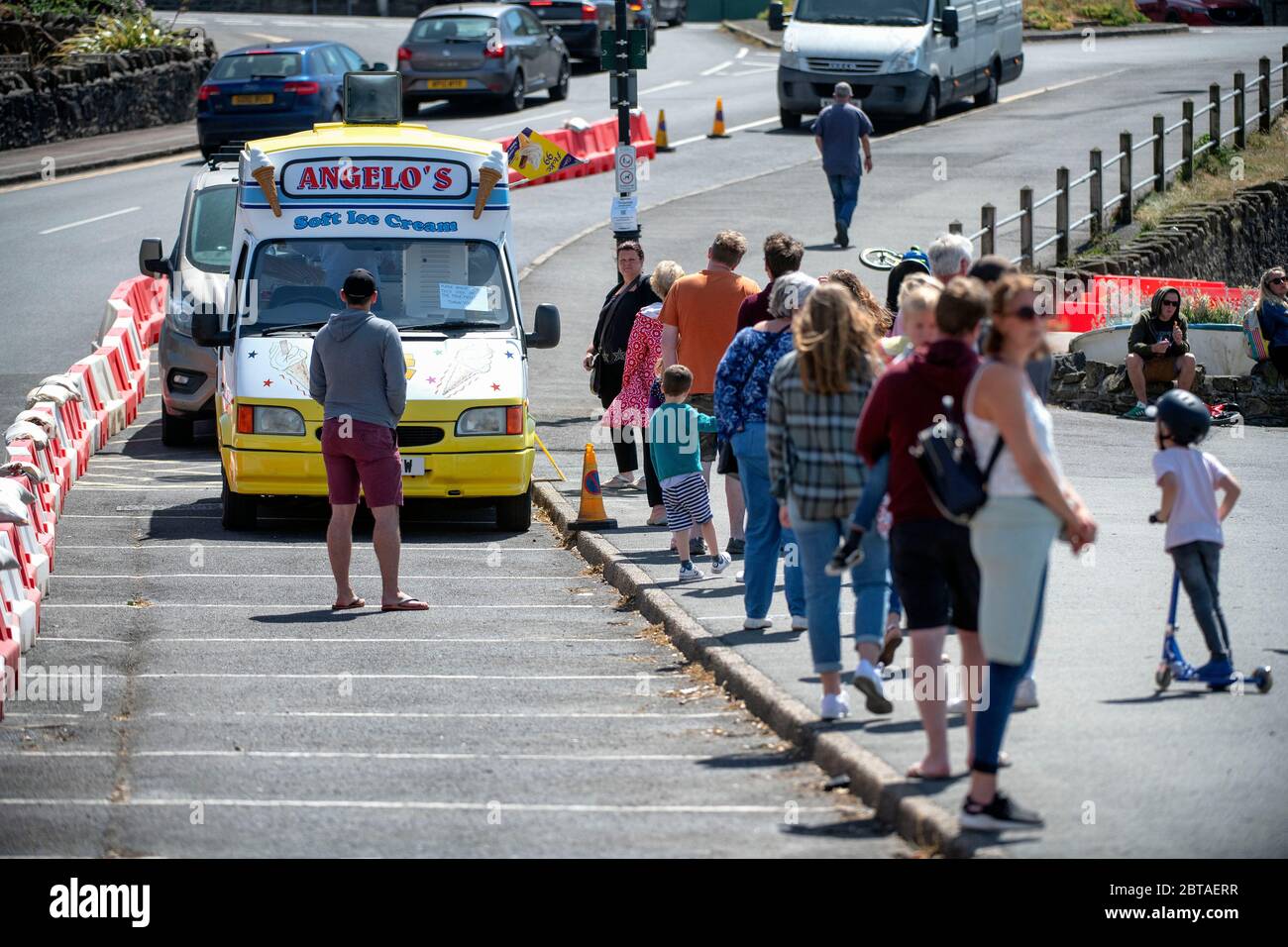 People queue for an ice cream on the sea front at Clevedon in Somerset after coronavirus lockdown restrictions were eased in England last week. Stock Photo
