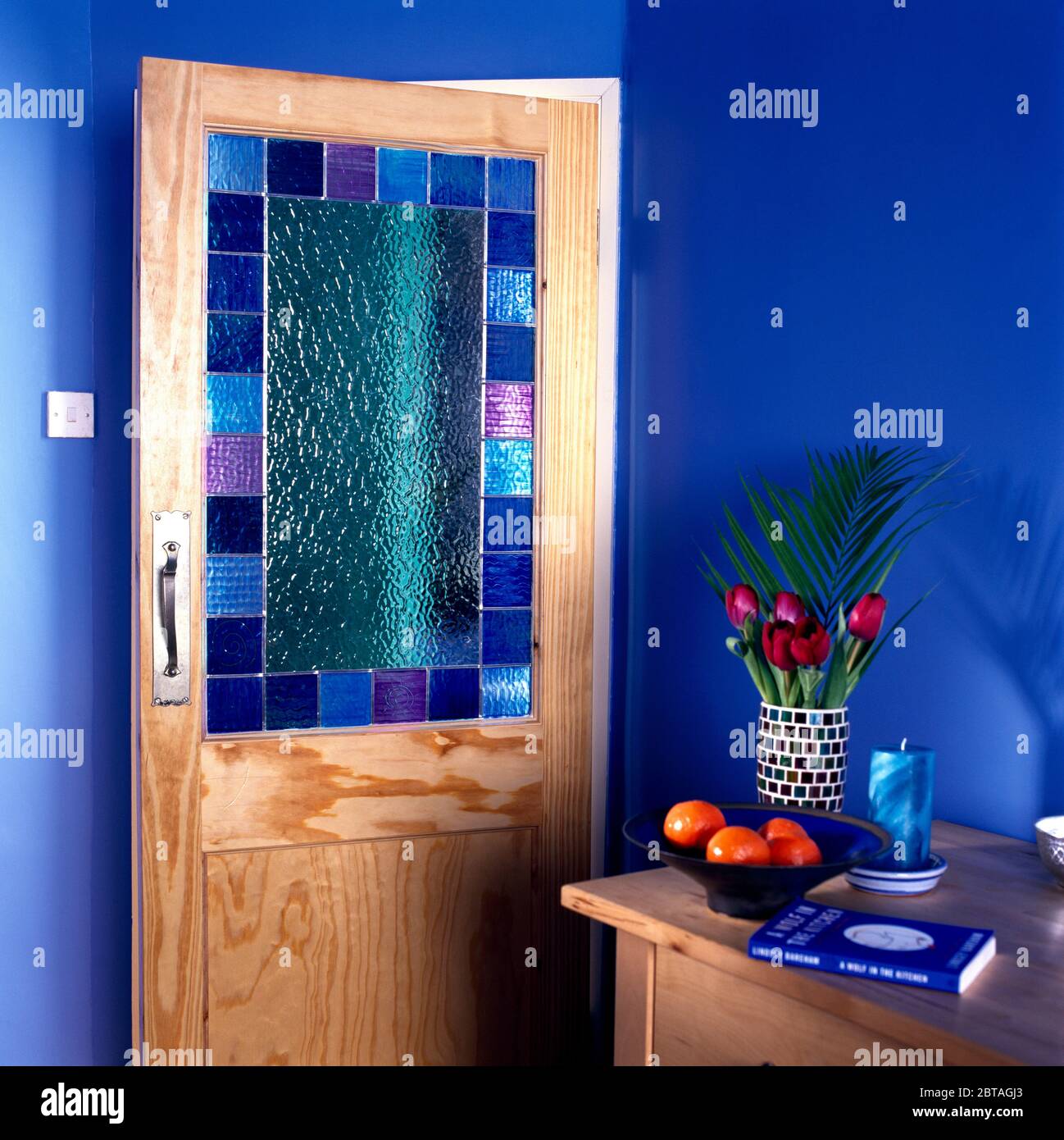 Stained glass panel in wooden door Stock Photo Alamy