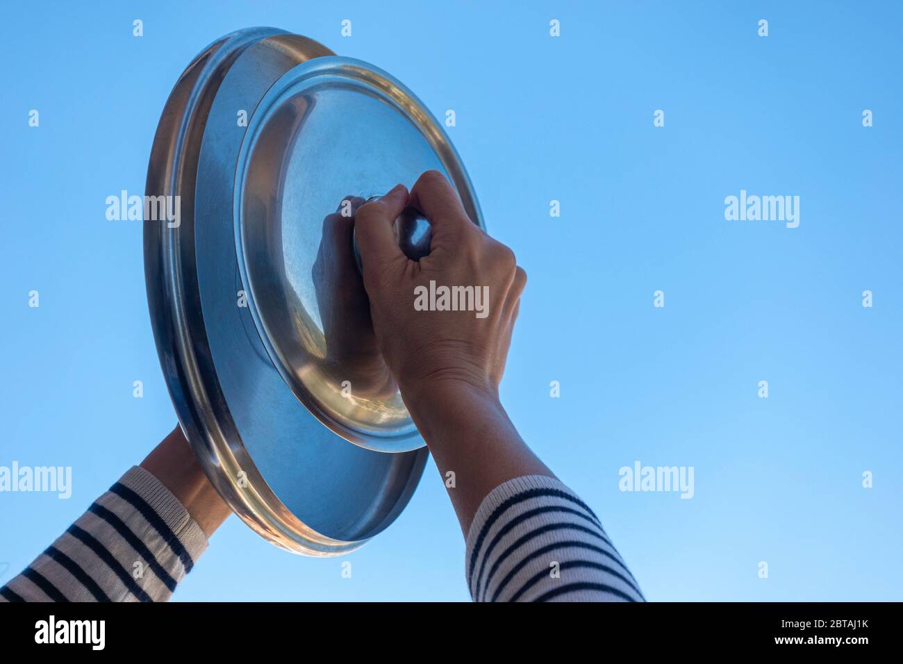 Banging pot with spoon hires stock photography and images Alamy